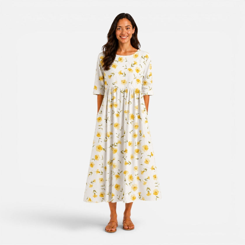Women's floral midi dress by FJØRNA with a spring and summer design, featuring a lightweight, flowy fabric and vibrant floral pattern.