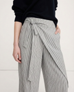 Women's high-waist cotton wide-leg trousers by FJØRNA, featuring a loose pull-on design and relaxed fit in a natural fabric.