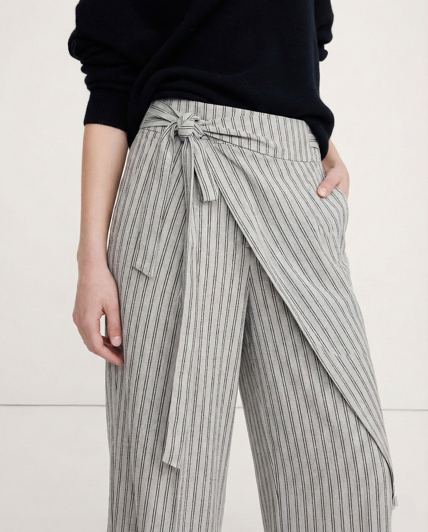 Women's high-waist cotton wide-leg trousers by FJØRNA, featuring a loose pull-on design and relaxed fit in a natural fabric.