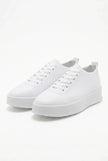 White FJØRNA men's slip-on trainers with a clean, minimalist design, perfect for casual and everyday wear.