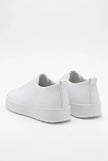 White FJØRNA men's slip-on trainers with clean, minimalist design, casual shoes perfect for everyday wear.