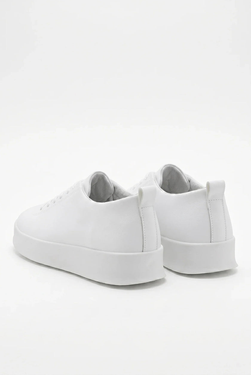 White FJØRNA men's slip-on trainers with clean, minimalist design, casual shoes perfect for everyday wear.