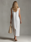 FJØRNA sleeveless midi casual dress with a flowy silhouette, featuring a fitted bodice and soft fabric for a relaxed look.