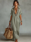 Red linen embroidered maxi dress for women by FJØRNA, featuring intricate embroidery and a flowing silhouette.
