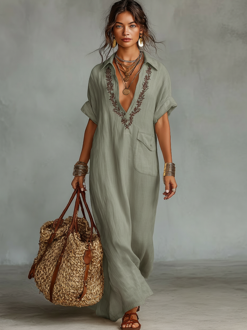 Red linen embroidered maxi dress for women by FJØRNA, featuring intricate embroidery and a flowing silhouette.