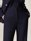 FJØRNA navy double-breasted two-piece suit set with tailored pants and blazer, stylish women's formal wear.