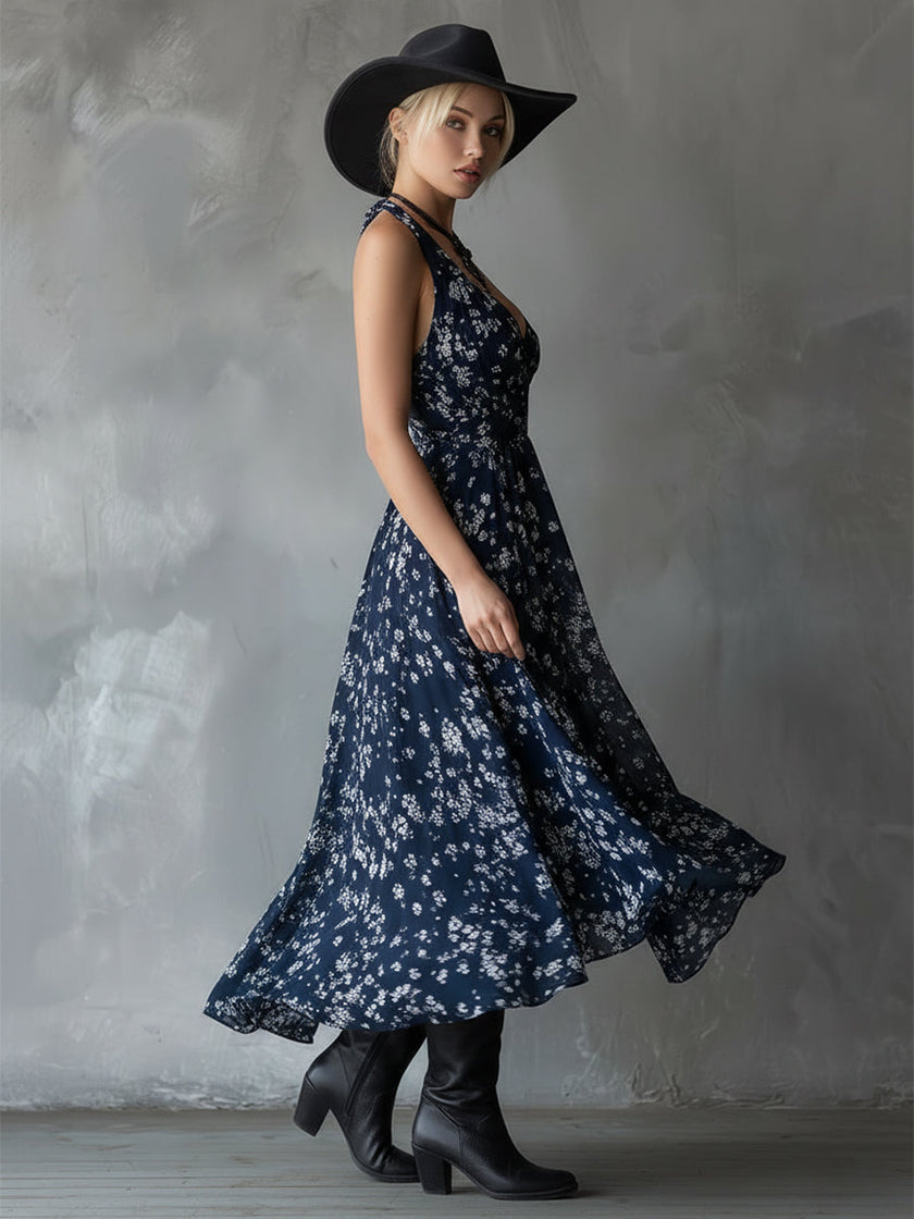 Navy blue chiffon floral maxi dress for women by FJØRNA, featuring a flowing design and vibrant floral pattern.