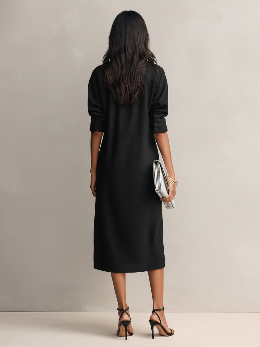 Black linen midi dress by FJØRNA, featuring a sleek evening dress design with a flowing silhouette and elegant style.