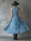 Navy blue chiffon floral maxi dress for women by FJØRNA, featuring a flowing silhouette and delicate floral pattern.