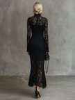 Black lace fishtail maxi dress by FJØRNA featuring intricate lace details and a fitted evening dress silhouette.