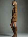 FJØRNA suede turtleneck mini dress for women, showcasing a stylish, fitted design with long sleeves and a smooth suede texture.