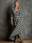 Womens maxi dress by FJØRNA featuring a flowing, elegant design with a fitted waist and floral pattern, suitable for casual or formal wear.