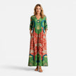 Green and red women's summer maxi dress by FJØRNA featuring a flowy, vibrant design perfect for warm weather.