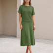 Green knit cropped two-piece set for women by FJØRNA, featuring a stylish co-ord outfit with a fitted top and matching bottoms.