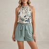 Green tropical high waist two-piece set for women by FJØRNA, featuring a stylish co-ord outfit with a fitted top and matching skirt.