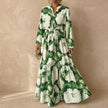 Green FJØRNA women's elegant maxi dress with V-neck and long sleeves, flowing and stylish for formal or casual occasions.