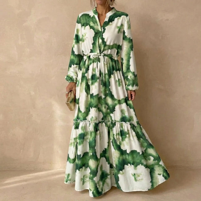 Green FJØRNA women's elegant maxi dress with V-neck and long sleeves, flowing and stylish for formal or casual occasions.