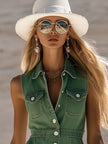 Green denim sleeveless mini dress for women by FJØRNA, featuring a fitted bodice and casual style, displayed on a mannequin.