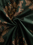 Green faux suede tassel maxi dress for women by FJØRNA, featuring a flowing silhouette and tassel details.