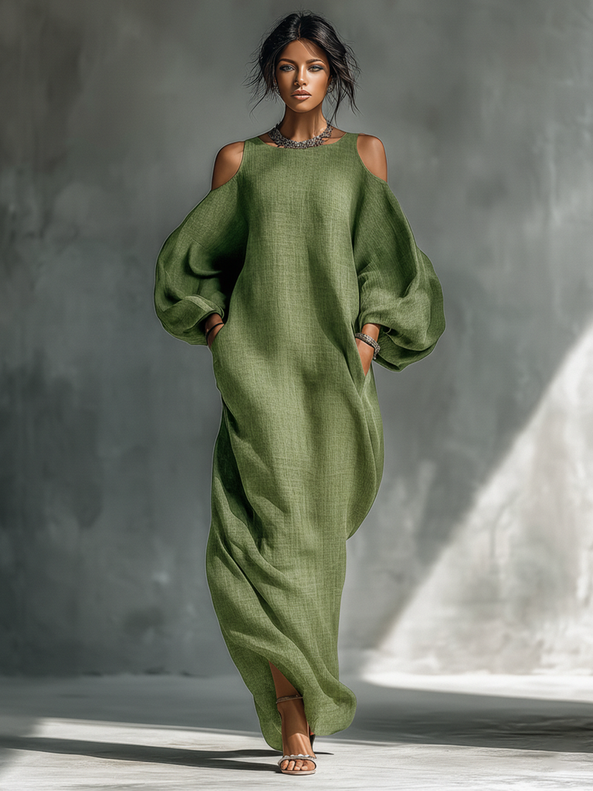 Green FJØRNA maxi dress for women, flowing and elegant, with a relaxed fit and sleeveless design, suitable for warm weather.