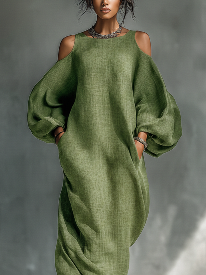 Green FJØRNA maxi dress for women, flowing sleeveless dress with a relaxed fit and elegant silhouette.