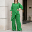 Green FJØRNA summer two-piece women's co-ord set with asymmetric design, featuring a stylish crop top and matching skirt.