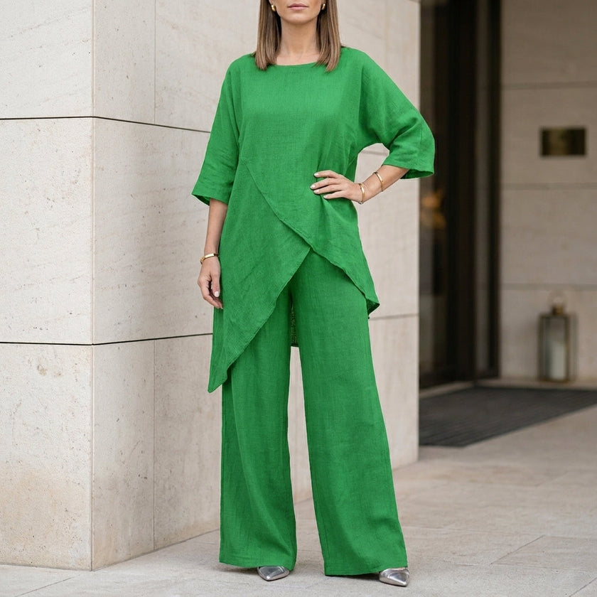 Green FJØRNA summer two-piece women's co-ord set with asymmetric design, featuring a stylish crop top and matching skirt.