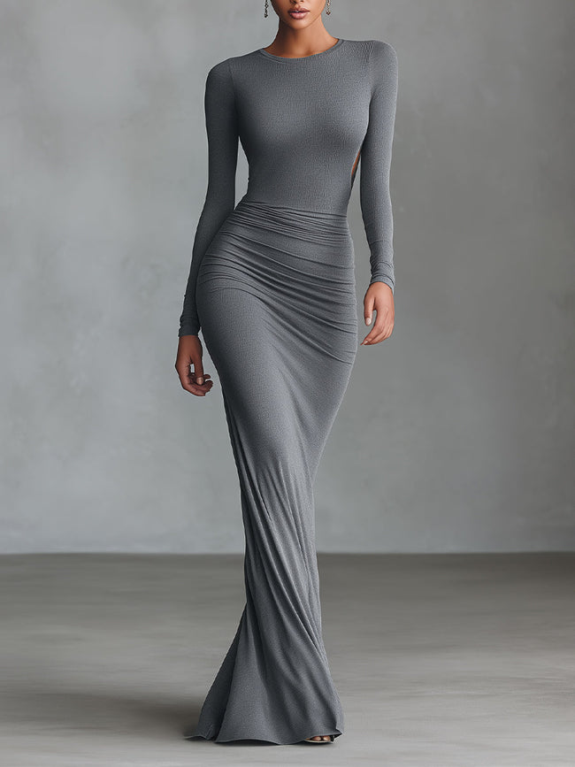 Grey knit ruched maxi dress by FJØRNA, elegant evening dress featuring a fitted bodice and flowing skirt.