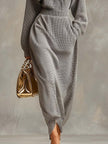Grey waffle long sleeve maxi dress by FJØRNA, casual dress with a relaxed fit and soft textured fabric, shown on a model.