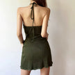 FJØRNA halter neck knitted mini dress for women, featuring a stylish design suitable for party or day wear, shown from the front.