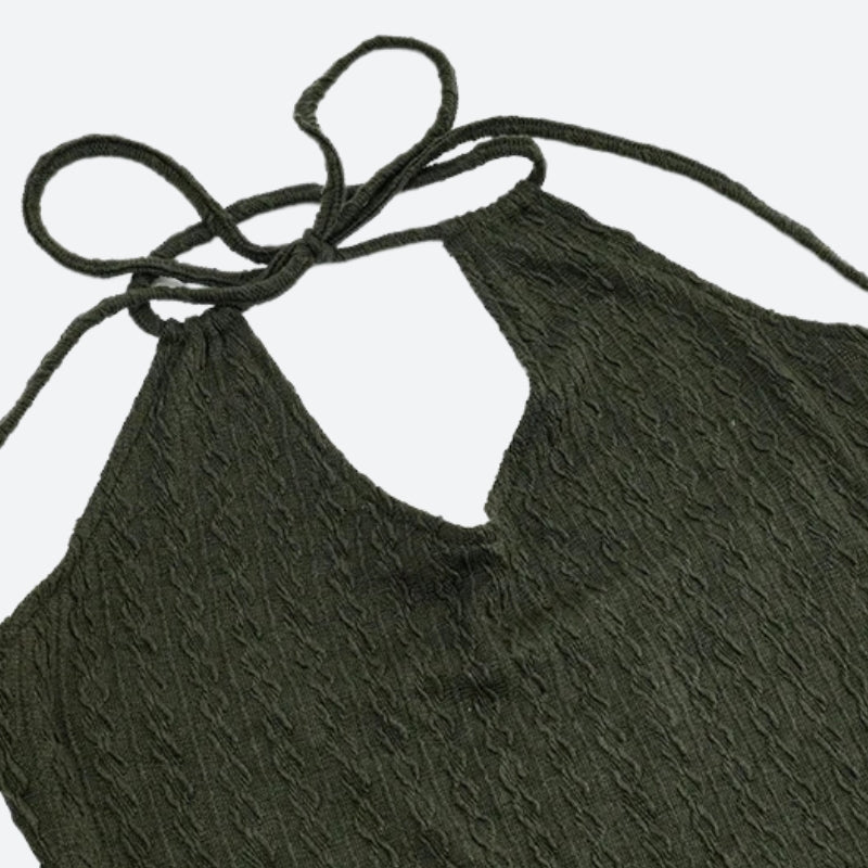 FJØRNA women's halter neck knitted mini dress, perfect for party or daytime wear, featuring a stylish, fitted design.