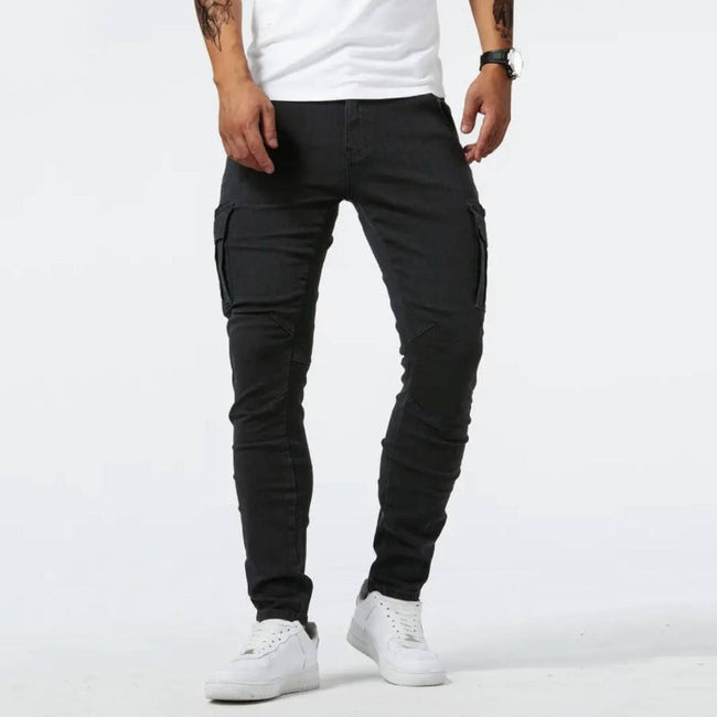 Men's stretch denim cargo pants by FJØRNA, showing casual fit with multiple pockets, suitable for everyday and leisure wear.