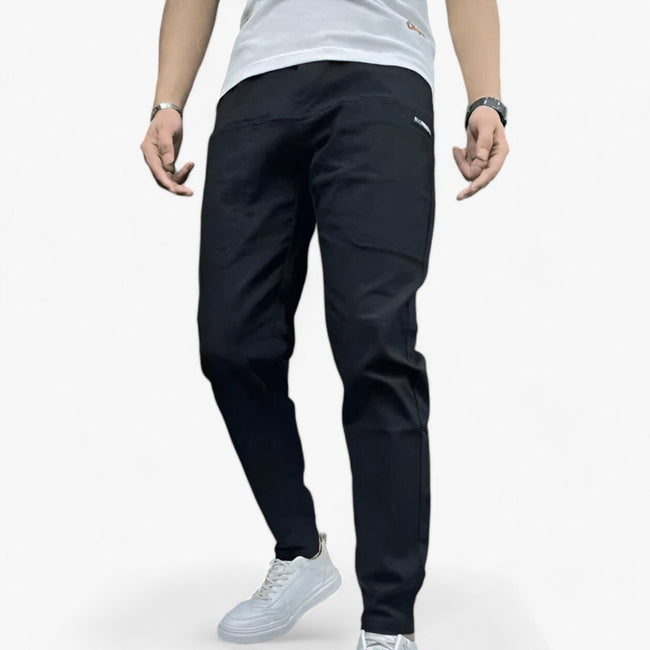 Men's FJØRNA cargo pants with stretch fabric and multiple front and back pockets, designed for comfort and durability.