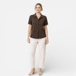 FJØRNA women's short sleeve button-up shirt, classic style, lightweight fabric, shown in a natural fit and casual design.