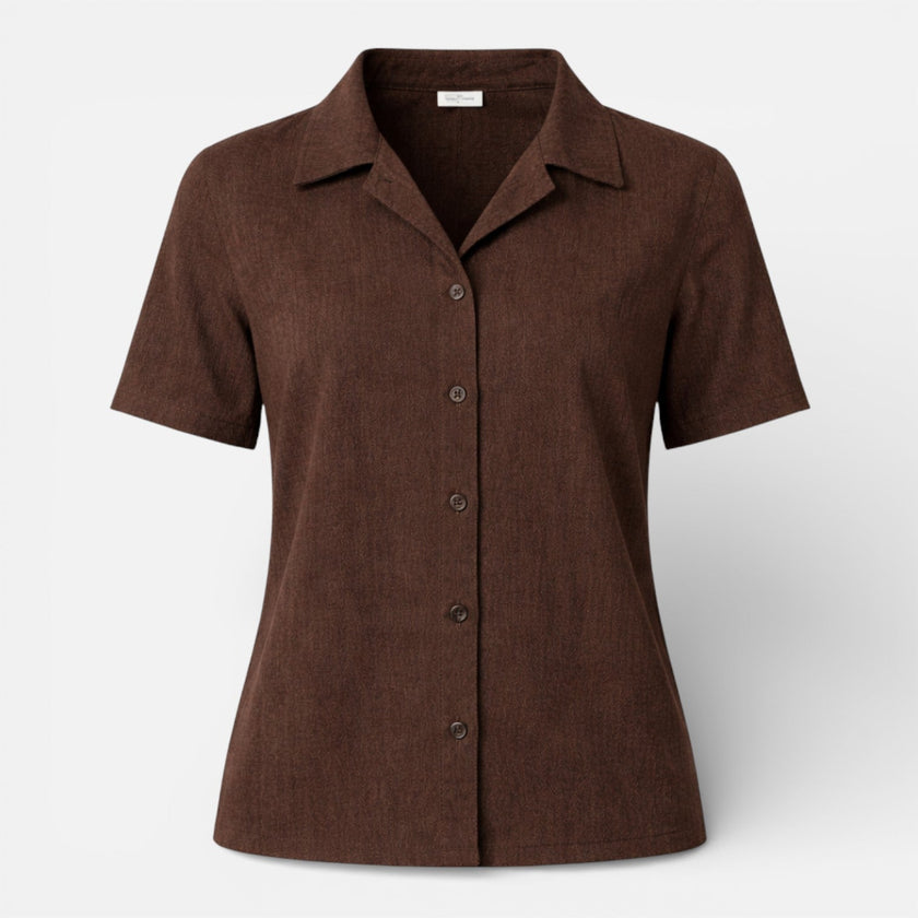 FJØRNA women's short sleeve button-up shirt with a classic design, shown in a light fabric with a collar and front buttons.