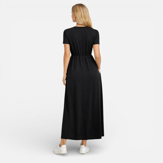 Women's maxi dress by FJØRNA featuring cotton fabric, classic short sleeves, and a comfortable, relaxed fit.