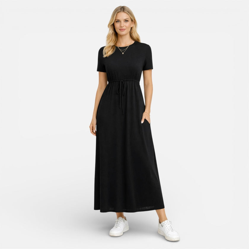 Women's FJØRNA cotton maxi dress with short sleeves, comfortable and classic for casual wear, shown in a natural fabric and fit.