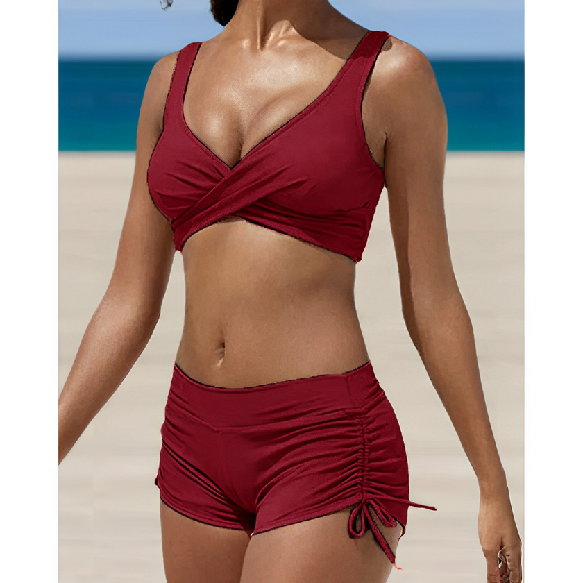 FJØRNA women's two-piece bikini swimwear with removable straps, featuring a vibrant design and adjustable tops.