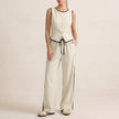 Ivory white women's summer two-piece co-ord set by FJØRNA featuring a button-front top and matching shorts.