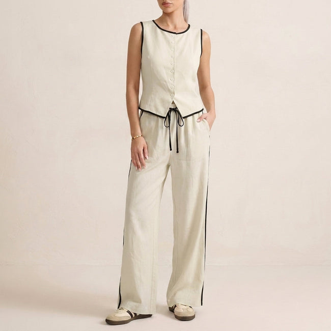 Ivory white women's summer two-piece co-ord set by FJØRNA featuring a button-front top and matching shorts.