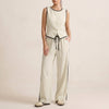 Ivory white women's summer two-piece co-ord set by FJØRNA featuring a button-front top and matching shorts.