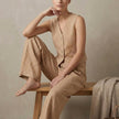 Khaki linen two-piece women's co-ord set with pleated top and matching trousers by FJØRNA.
