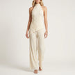Khaki FJØRNA women's two-piece co-ord set with pleated halter neck top and matching high-waisted pants.