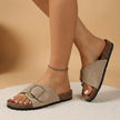 Khaki FJØRNA orthopedic cork slide sandals with adjustable buckle and open toe, featuring cushioned footbed and supportive design.