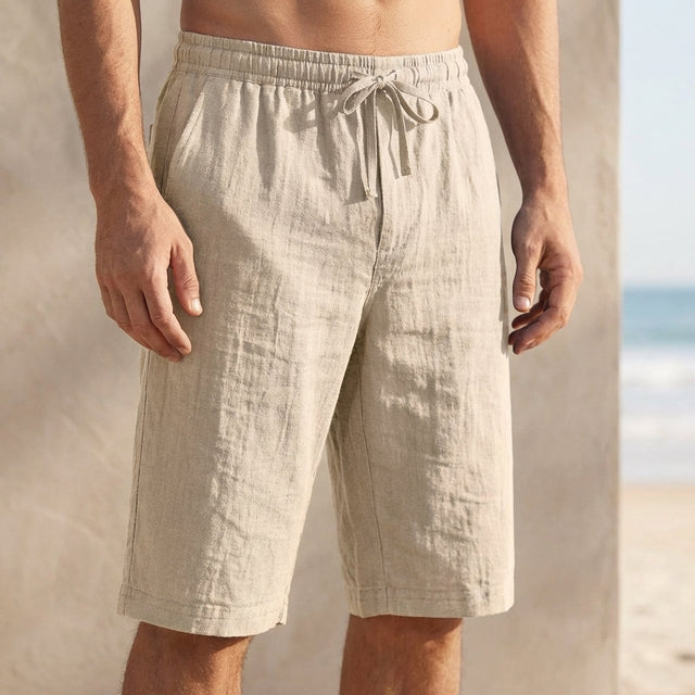Beige linen drawstring chino shorts for men by FJØRNA, tailored fit with front pockets and relaxed casual style.