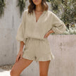 Khaki women's summer two-piece ruffle co-ord set by FJØRNA with lightweight fabric and matching top and skirt.