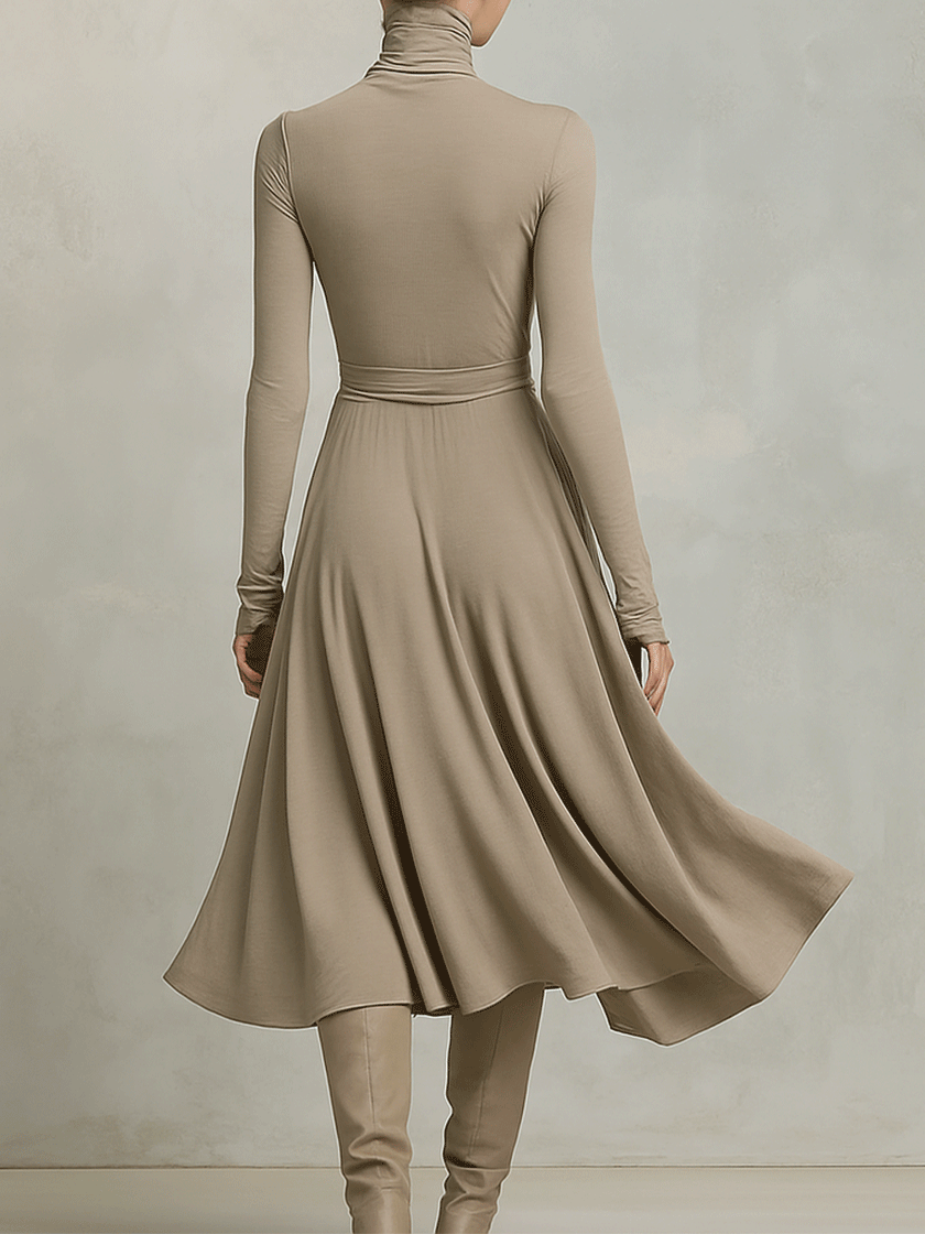 FJØRNA knit long sleeve midi evening dress featuring a fitted silhouette and soft fabric, shown on a model.