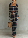 FJØRNA knit maxi dress for women, featuring a long, cozy knitted design with a fitted waist and flowing skirt.
