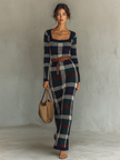FJØRNA women's knit maxi dress featuring a flowing silhouette, long sleeves, and a cozy, textured fabric for elegant comfort.