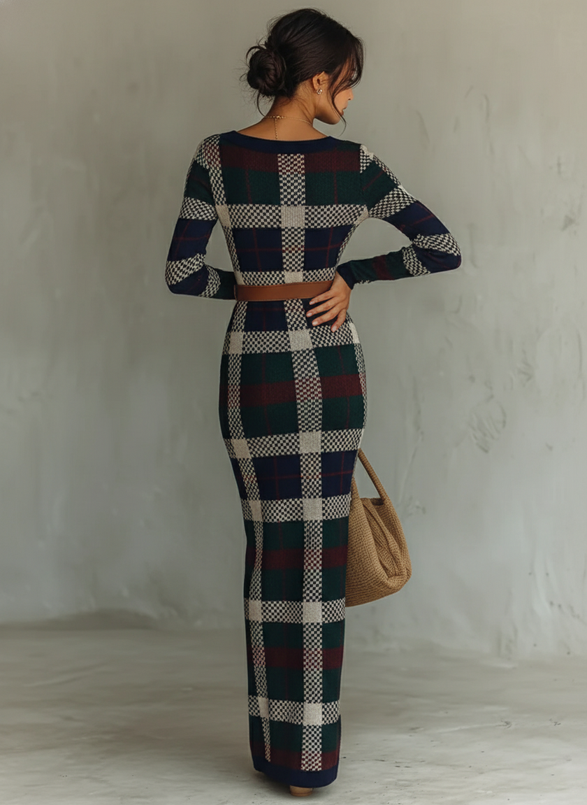 FJØRNA women's knit maxi dress featuring a flowing silhouette and long sleeves, perfect for casual or chic occasions.